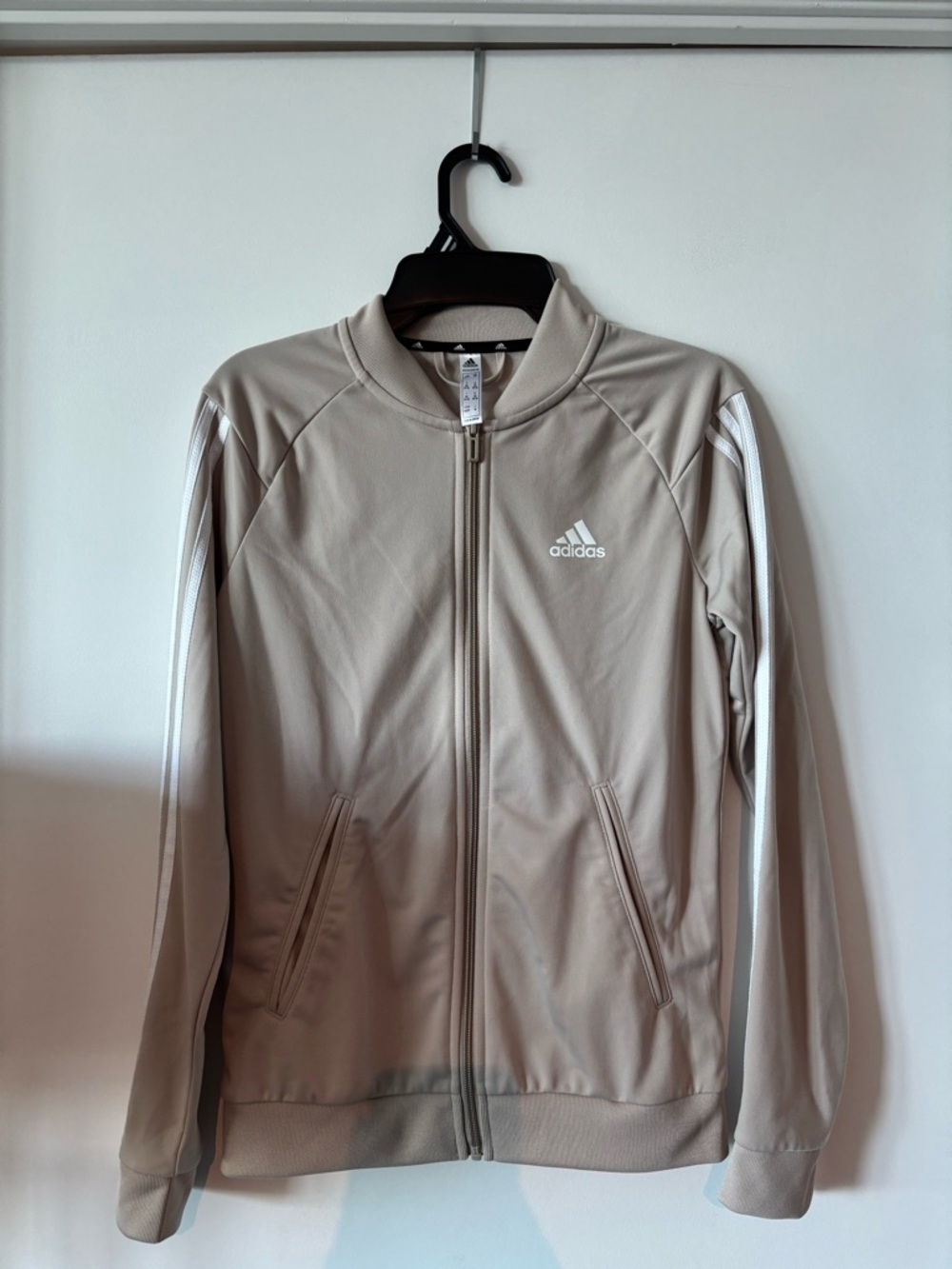 adidas beige zip-up athletic jacket with white logo trim